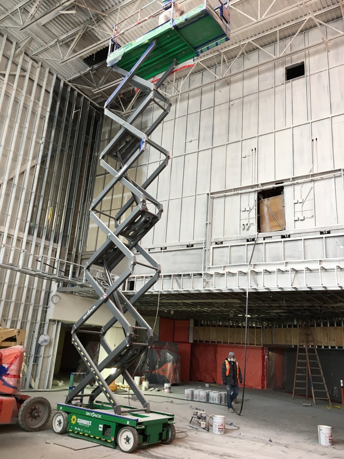 Commercial painting project with lift